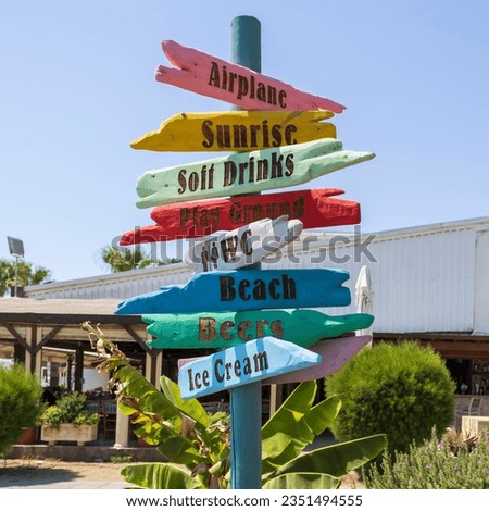 Colorful directional signage on sea beach in Larnaca, Cyprus