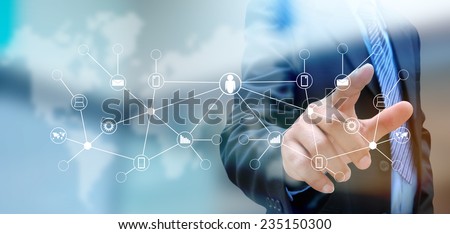 hand pushing social network button on a touch screen interface  Royalty-Free Stock Photo #235150300
