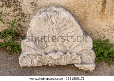 Carved antiquities scattered about at the  Ancient Agora in Athens, Greece
