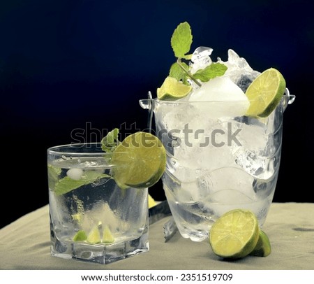 Summer refreshing drink, Mojito with Ice, Lime and Mint.