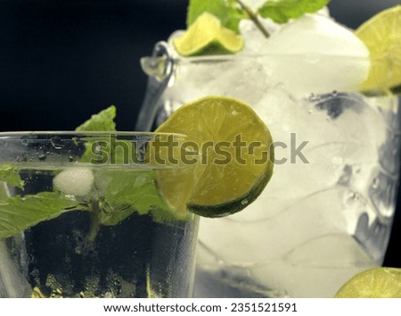 Mojito juice filled with ice, lime and mint. Toast.