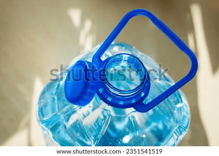 Water bottle with attached cap for easy collection and recycling. Tethered Cap. Litter prevention EU Directive 2019904. Royalty-Free Stock Photo #2351541519