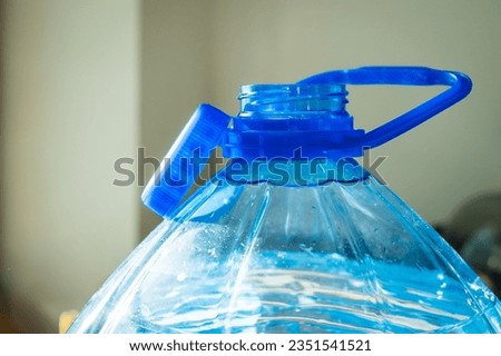Water bottle with attached cap for easy collection and recycling. Tethered Cap. Litter prevention EU Directive 2019904. Royalty-Free Stock Photo #2351541521