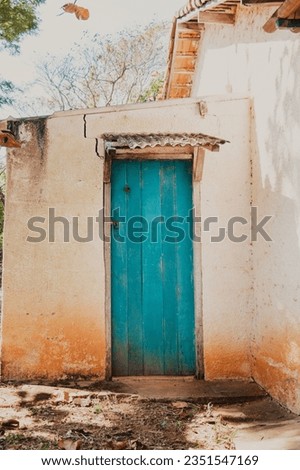 teal door in the countryhouse Royalty-Free Stock Photo #2351547169