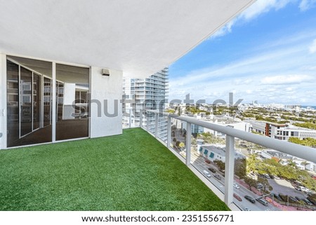 Exterior photo taken from a balcony somewhere in Miami Beach