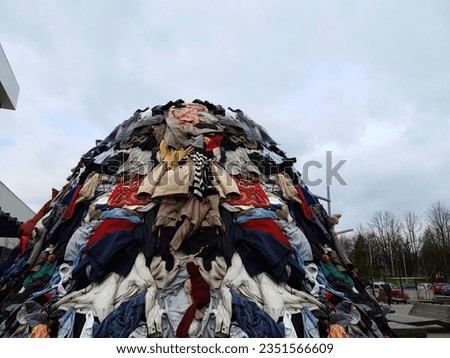 waste pile large pollution heap fashion industry trash in nature landscape garbage stack of cloth industrial pollution awareness global pollution background Royalty-Free Stock Photo #2351566609