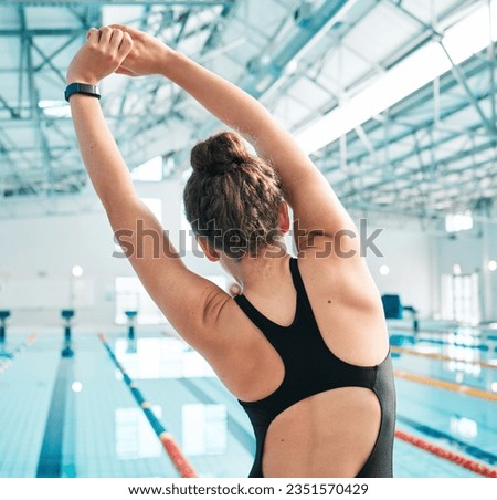 Back, swimming pool or girl stretching arms or ready for race competition, exercise or training. Healthy athlete swimmer, flexible body or active woman in workout for fitness warm up or wellness