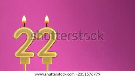 Birthday card with candle number 22 - purple background