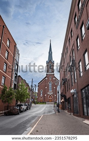 Tall church at the end of small street in downtown Lexington, Kentucky during sunrise Royalty-Free Stock Photo #2351578295