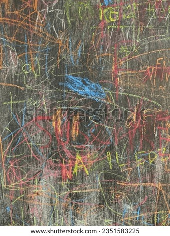Colorful doodles on a blackboard, crossed out with colored chalk. Royalty-Free Stock Photo #2351583225