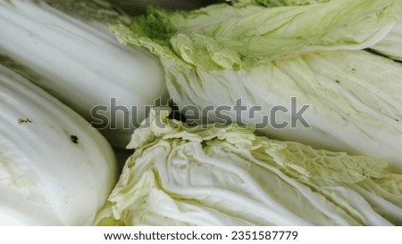 a pile of Chinese cabbage in a traditional vegetable stall. background chinese cabbage