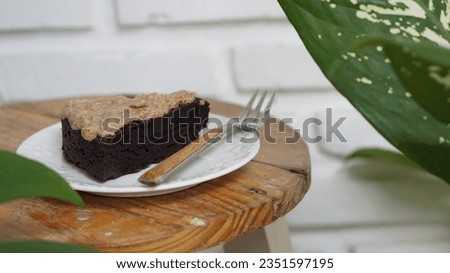 a slice of brownies cake on wooden table