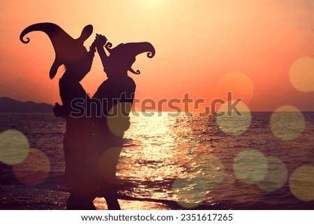 Sunset Silhouette Dance with Witch Hat: Halloween Lover Celebrating in Dramatic Costume