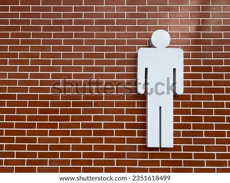 The red brick wall has a sign indicating the white men's restroom.