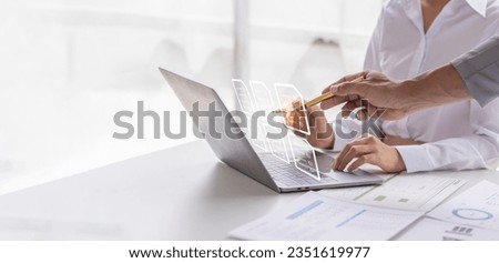 Businessteam signs an electronic document on a digital document on a virtual laptop computer screen,Paperless workplace idea, e-signing, electronic signature, document management.	 Royalty-Free Stock Photo #2351619977