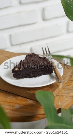 a slice of brownies cake isolated in white plate