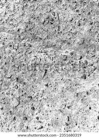 Abstract background of weathered asphalt road surface close up. Directly above view with silhouette filter.