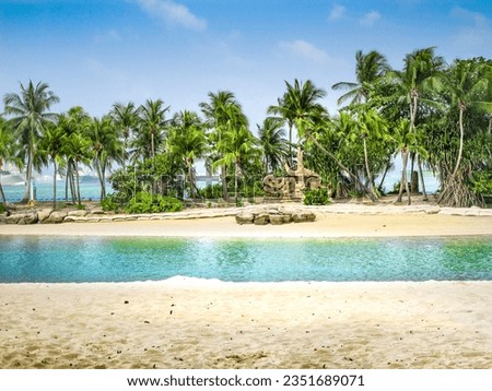 Sentosa Palawan Beach is one of several long and broad sand beaches located on the southwest side of Sentosa Island, Singapore Its deep, pale sands slip into calm turquoise waters Royalty-Free Stock Photo #2351689071