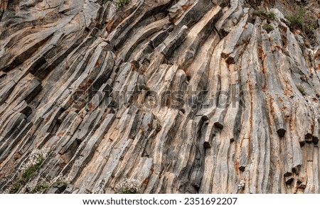 natural rock background texture. rock formation, unusual mountain topography, geological backdrop. Basalt columns formation