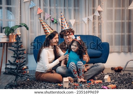 Happy lovely family father, mother and children celebrate Christmas and new year, light sparklers.	