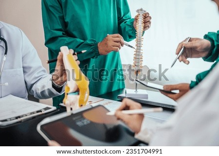 Plastic surgery Medical meeting healthcare and doctors, orthopedic surgeon, orthopedist, ER surgery team discussing on diagnostic exam, Breast implants, Breast enlargement surgery, Hair transplant Royalty-Free Stock Photo #2351704991