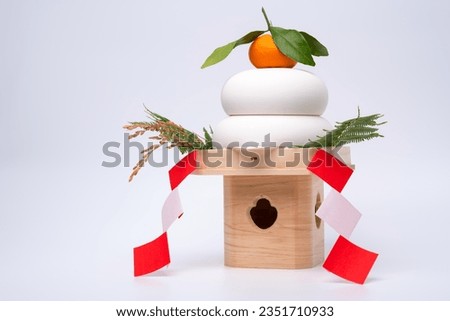 "KAGAMIMOCHI" is placed on the right side and photographed against a white background. Royalty-Free Stock Photo #2351710933