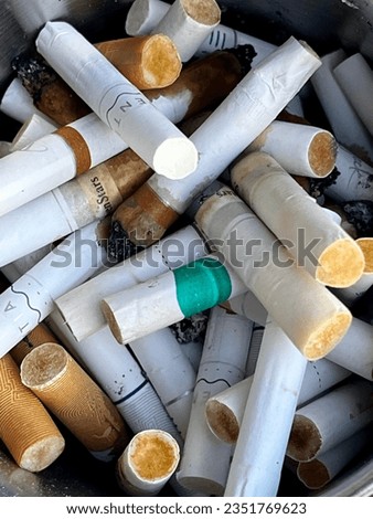 cigarette butts, cigarette residue that has piled up.