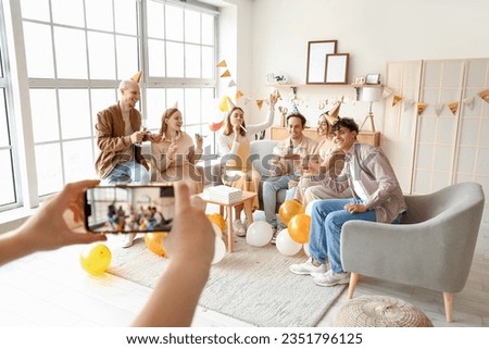 Group of young friends celebrating Birthday at home