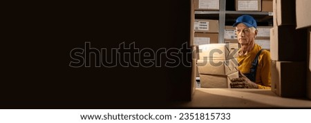 Warehouse old worker take boxes from shelf in big warehouse factory, Online shopping store for logistic service to deliver the shipment. Banner. Copy space