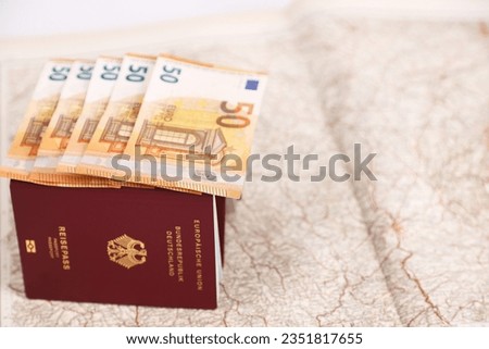 money and passport lie on the map, travel, travel planning, inflation, passport and money, against the background of the map, traffic map, passport cost, plane ticket, cost increase, finance, expensiv