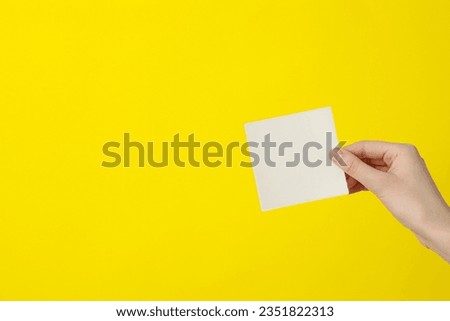 White blank paper in female hands, place for text