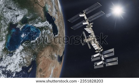 International Space Station on low-orbit of Earth with rising Sun. Elements of this image furnished by NASA. Royalty-Free Stock Photo #2351828203