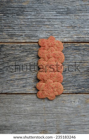 Gingerbread cookies against wood background