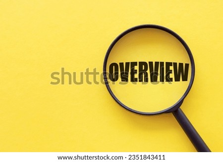 Overview word. Summary and recap concept. Magnifying glass on yellow background Royalty-Free Stock Photo #2351843411
