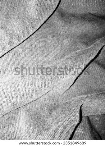 Abstract background of dark fabric texture.