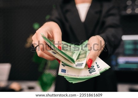 Female beautiful hands count dollar bills or pay with cash. female hands with dollars. woman shopping. cash in hand