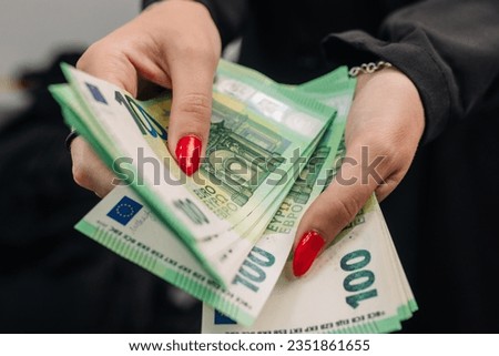 Female beautiful hands count money or pay in cash. female hands with euro woman makes purchases. Money in hand.