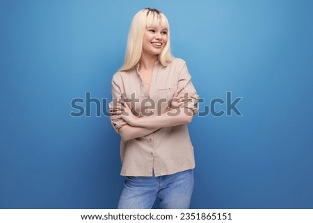 close-up photo of charming european blonde woman in casual outfit on studio background