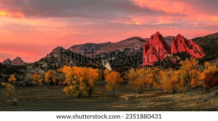 Sunset in the autumn mountains. Autumn mountain landscape in evening. Autumn mountains at sunset. Sunset autumn mountain panorama Royalty-Free Stock Photo #2351880431