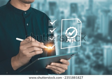 Businessman mark checklist for best quality score, product warranty, ISO standard and quality assurance concept. Royalty-Free Stock Photo #2351881827