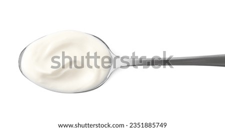 Spoon with delicious sour cream isolated on white, top view Royalty-Free Stock Photo #2351885749