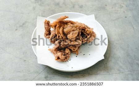 Crunchy and flavorful crispy chicken skin Royalty-Free Stock Photo #2351886507