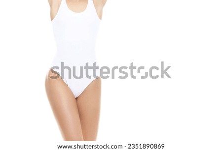 Young, fit and beautiful woman in white swimsuit over white background. Healthcare, diet, sport and fitness concept.