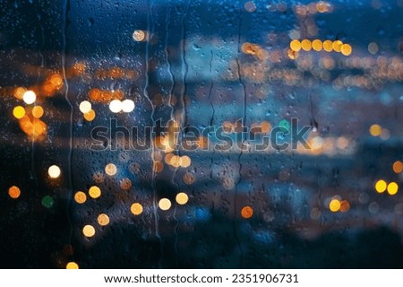 raindrops on the window and Bilbao city background Royalty-Free Stock Photo #2351906731