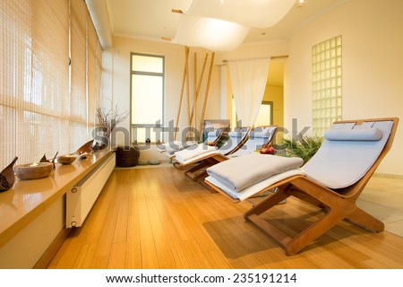 Close-up of loungers in cozy spa room Royalty-Free Stock Photo #235191214