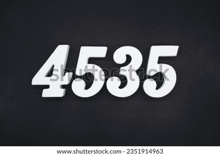 Black for the background. The number 4535 is made of white painted wood.