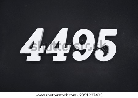 Black for the background. The number 4495 is made of white painted wood.