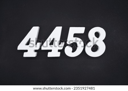 Black for the background. The number 4458 is made of white painted wood.
