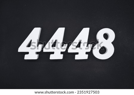 Black for the background. The number 4448 is made of white painted wood.
