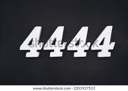 Black for the background. The number 4444 is made of white painted wood.